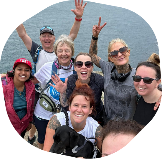 group of smiling people on a walk
