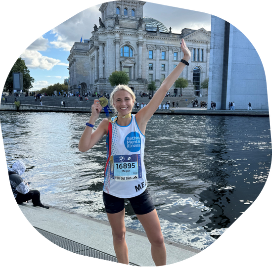 Runner celebrating with medal
